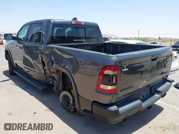 2020 Ram 1500 Rebel with VIN 1C6SRFLT1LN398728, listed as a IAAI auction lot 42526369 with 85,040 mi miles and . Bid and sale history available at DreamBid. Image 3.