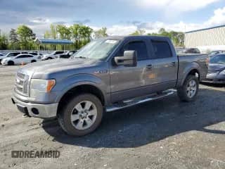 2012 Ford F-150 Lariat with VIN 1FTFW1E62CFA80561, listed as a Copart auction lot 52296795 with 150,492 mi miles and Salvage title. Bid and sale history available at DreamBid. Image 1.