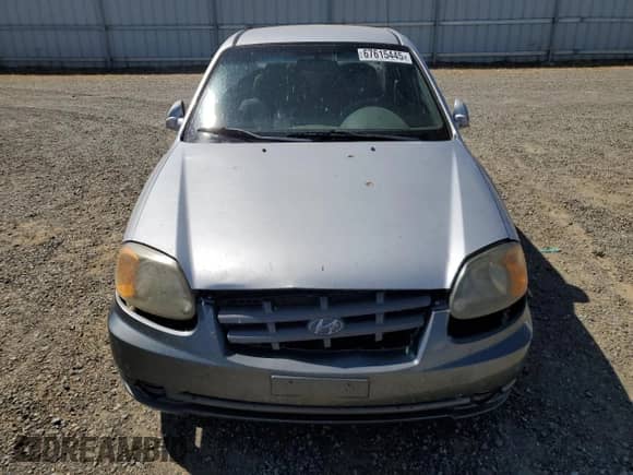 2003 Hyundai Accent GL z VIN KMHCG45CX3U474856, wystawiony jako Copart lot #67615445 z przebiegiem 205 400 mil mil oraz Szkoda całkowita • Salvage title. Historia ofert i sprzedaży dostępna na DreamBid. Obrazek 5.
