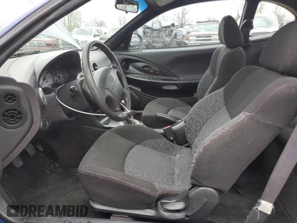 2001 Hyundai Tiburon с VIN KMHJG25F91U250108, выставлен на аукционе Copart как лот 50905795 с пробегом 61 803 миль миль и Списание • Salvage title. История ставок и продаж доступна на DreamBid. Изображение 7.