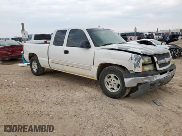 2004 Chevrolet Silverado 1500 Work Truck with VIN 2GCEC19V641173274, listed as a Copart auction lot 70104735 with 184,952 mi miles and Salvage title. Bid and sale history available at DreamBid. Image 4.