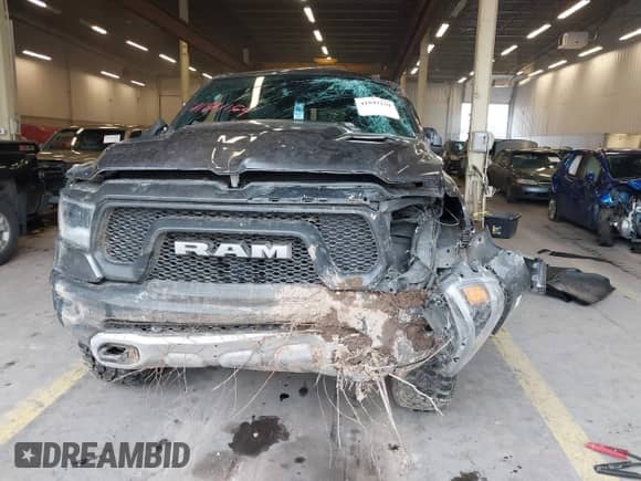 2020 Ram 1500 Rebel z VIN 1C6SRFLT0LN162491, wystawiony jako IAAI lot #41841159 z przebiegiem 58 265 mil mil oraz . Historia ofert i sprzedaży dostępna na DreamBid. Obrazek 12.