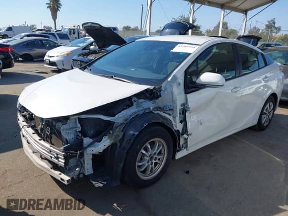 2018 Toyota Prius Two with VIN JTDKBRFUXJ3058120, listed as a IAAI auction lot 43289991 with 116,070 mi miles and . Bid and sale history available at DreamBid. Image 19.