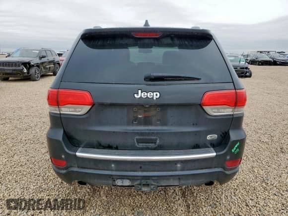 2015 Jeep Grand Cherokee Overland with VIN 1C4RJFCG7FC229492, listed as a Copart auction lot 82439445 with 104,257 mi miles and Salvage title. Bid and sale history available at DreamBid. Image 6.