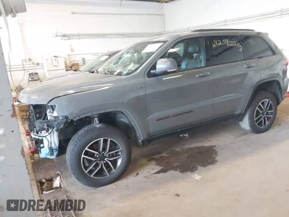 2020 Jeep Grand Cherokee Trailhawk with VIN 1C4RJFLG6LC101899, listed as a IAAI auction lot 42592283 with 116,619 mi miles and . Bid and sale history available at DreamBid. Image 2.