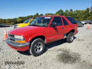2000 Chevrolet Blazer LS z VIN 1GNCS18W9YK241469, wystawiony jako Copart lot #75532144 z przebiegiem 216 870 mil mil oraz Szkoda całkowita • Salvage title. Historia ofert i sprzedaży dostępna na DreamBid. Obrazek 1.