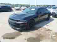 2018 Dodge Charger R/T with VIN 2C3CDXCT7JH209866, listed as a IAAI auction lot 43157349 with 163,502 mi miles and . Bid and sale history available at DreamBid. Image 2.