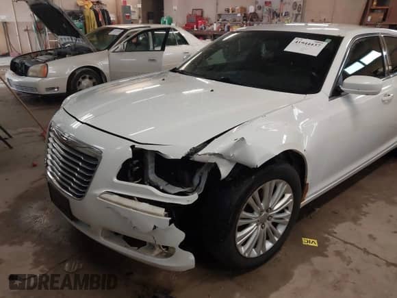 2013 Chrysler 300 with VIN 2C3CCARG6DH505220, listed as a IAAI auction lot 41944437 with 196,548 mi miles and . Bid and sale history available at DreamBid. Image 6.