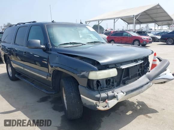 2003 Chevrolet Suburban LS z VIN 3GNEC16TX3G243519, wystawiony jako IAAI lot #42451637 z przebiegiem 133 806 mil mil oraz . Historia ofert i sprzedaży dostępna na DreamBid. Obrazek 1.