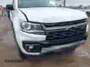 2021 Chevrolet Colorado 4WD Z71 z VIN 1GCGTDEN9M1256767, wystawiony jako IAAI lot #42188311 z przebiegiem 55 116 mil mil oraz . Historia ofert i sprzedaży dostępna na DreamBid. Obrazek 6.