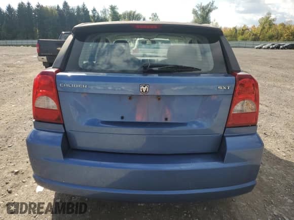 2007 Dodge Caliber SXT with VIN 1B3HB48B57D218885, listed as a Copart auction lot 83769795 with 104,586 mi miles and Salvage title. Bid and sale history available at DreamBid. Image 6.