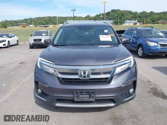 2021 Honda Pilot Touring 7-Passenger with VIN 5FNYF6H62MB041945, listed as a IAAI auction lot 43066698 with 102,187 mi miles and . Bid and sale history available at DreamBid. Image 12.