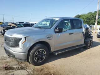 2023 Ford F-150 Lightning Pro with VIN 1FTVW1EL4PWG52432, listed as a Copart auction lot 67263165 with 20,136 mi miles and Salvage title. Bid and sale history available at DreamBid. Image 1.