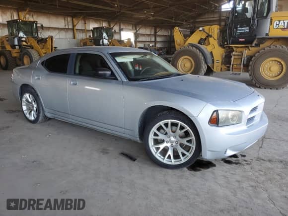 2009 Dodge Charger SE with VIN 2B3KA43D39H505990, listed as a Copart auction lot 71044214 with 223,573 mi miles and Salvage title. Bid and sale history available at DreamBid. Image 4.