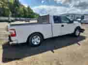 2007 Ford F-150 STX with VIN 1FTRX12W57FA37403, listed as a Copart auction lot 84213265 with 2,342,455 mi miles and Salvage title. Bid and sale history available at DreamBid. Image 3.