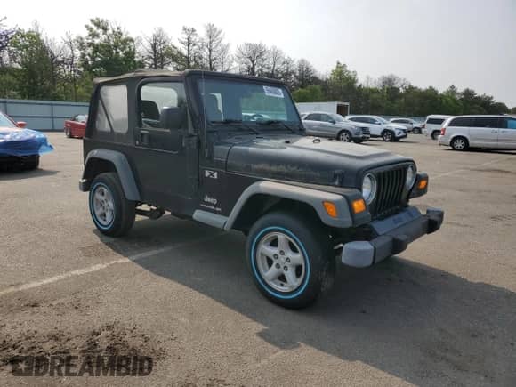 2003 Jeep Wrangler X z VIN 1J4FA39S23P359983, wystawiony jako Copart lot #59469005 z przebiegiem 118 585 mil mil oraz Czysty tytuł • Clean title. Historia ofert i sprzedaży dostępna na DreamBid. Obrazek 4.