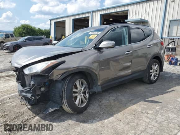 2014 Hyundai Santa Fe with VIN 5XYZW3LA1EG210121, listed as a Copart auction lot 68823255 with 117,207 mi miles and Salvage title. Bid and sale history available at DreamBid. Image 1.