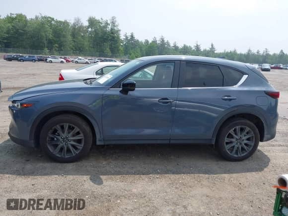 2023 Mazda CX-5 S Carbon Edition z VIN JM3KFBCM5P0179462, wystawiony jako IAAI lot #42451109 z przebiegiem 14 170 mil mil oraz . Historia ofert i sprzedaży dostępna na DreamBid. Obrazek 14.