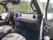 2021 Jeep Wrangler Unlimited Sahara High Altitude with VIN 1C4HJXEN6MW851686, listed as a IAAI auction lot 42214389 with 58,409 mi miles and . Bid and sale history available at DreamBid. Image 5.