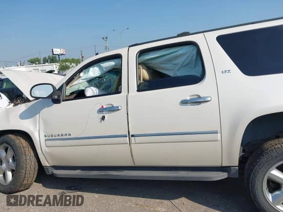 2013 Chevrolet Suburban LTZ with VIN 1GNSCKE03DR252662, listed as a IAAI auction lot 43209732 with 146,502 mi miles and . Bid and sale history available at DreamBid. Image 13.