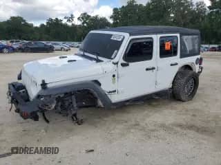 2023 Jeep Wrangler Sport with VIN 1C4HJXDGXPW596127, listed as a Copart auction lot 56645205 with 64,257 mi miles and Salvage title. Bid and sale history available at DreamBid. Image 1.