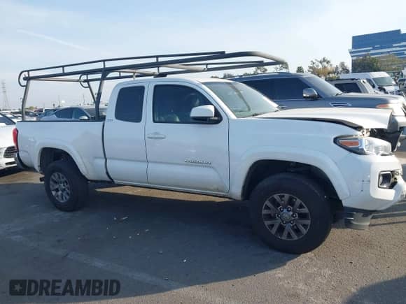 2018 Toyota Tacoma SR5 with VIN 5TFRZ5CN3JX064821, listed as a IAAI auction lot 41478807 with 106,495 mi miles and . Bid and sale history available at DreamBid. Image 14.