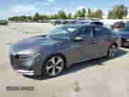 2018 Honda Accord Touring z VIN 1HGCV1F91JA004775, wystawiony jako Copart lot #71089465 z przebiegiem 28 780 mil mil oraz Szkoda całkowita • Salvage title. Historia ofert i sprzedaży dostępna na DreamBid. Obrazek 1.