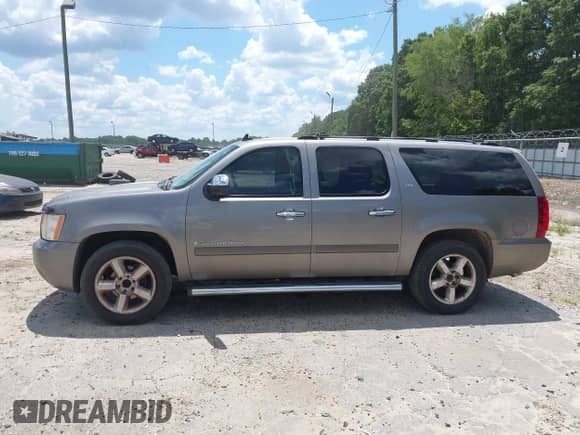 2007 Chevrolet Suburban LT z VIN 3GNFC16007G175621, wystawiony jako IAAI lot #42847597 z przebiegiem 194 071 mil mil oraz . Historia ofert i sprzedaży dostępna na DreamBid. Obrazek 6.