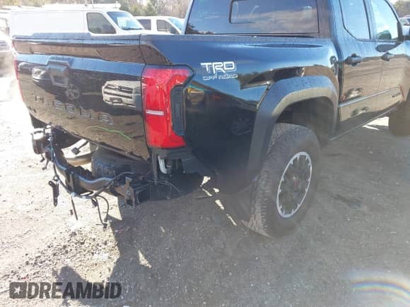 2024 Toyota Tacoma SR5 with VIN 3TMLB5JN0RM008463, listed as a IAAI auction lot 40979020 with 4,710 mi miles and . Bid and sale history available at DreamBid. Image 6.