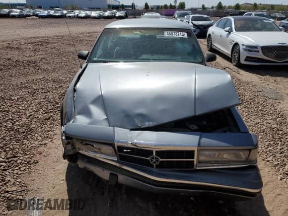 1991 Dodge Dynasty LE with VIN 1B3XC56R9MD115785, listed as a Copart auction lot 48073715 with 64,483 mi miles and Salvage title. Bid and sale history available at DreamBid. Image 5.