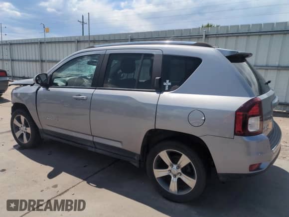 2016 Jeep Compass Latitude with VIN 1C4NJDEB4GD638985, listed as a Copart auction lot 62556945 with 83,142 mi miles and Salvage title. Bid and sale history available at DreamBid. Image 2.