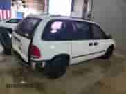 2000 Dodge Caravan with VIN 2B4GP25G4YR791420, listed as a Copart auction lot 83426754 with 141,635 mi miles and Salvage title. Bid and sale history available at DreamBid. Image 3.
