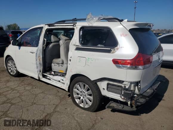 2014 Toyota Sienna XLE with VIN 5TDYK3DC9ES452147, listed as a Copart auction lot 84392215 with 161,656 mi miles and Salvage title. Bid and sale history available at DreamBid. Image 2.