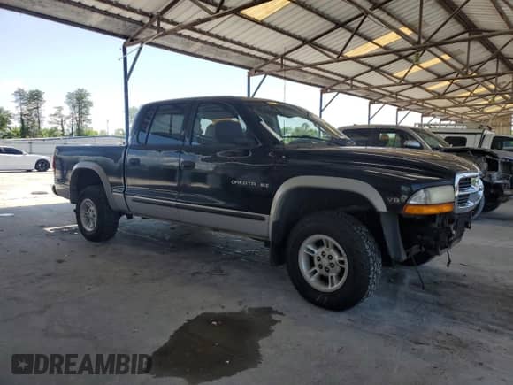 2000 Dodge Dakota Sport z VIN 1B7GG2AN9YS793766, wystawiony jako Copart lot #56201465 z przebiegiem Nie podano mil oraz Nie do naprawy • Non repairable. Historia ofert i sprzedaży dostępna na DreamBid. Obrazek 4.