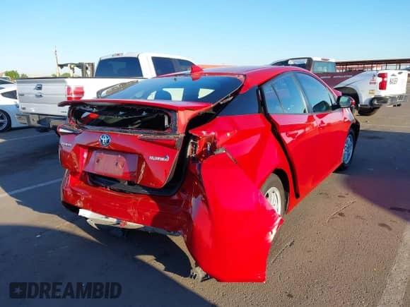 2021 Toyota Prius L Eco with VIN JTDKAMFU6M3152201, listed as a IAAI auction lot 43278670 with 144,414 mi miles and . Bid and sale history available at DreamBid. Image 4.