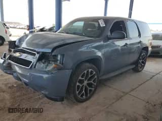2013 Chevrolet Tahoe Commercial with VIN 1GNLC2E0XDR266045, listed as a Copart auction lot 68174475 with 157,407 mi miles and Salvage title. Bid and sale history available at DreamBid. Image 1.