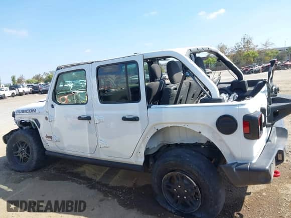 2023 Jeep Wrangler Rubicon with VIN 1C4HJXFG1PW600353, listed as a IAAI auction lot 43338003 with 26,306 mi miles and . Bid and sale history available at DreamBid. Image 14.