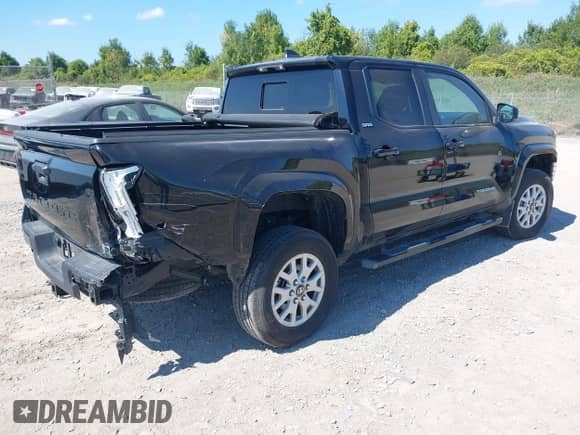 2024 Toyota Tacoma SR5 with VIN 3TMLB5JN4RM068147, listed as a IAAI auction lot 43177753 with 15,469 mi miles and . Bid and sale history available at DreamBid. Image 4.