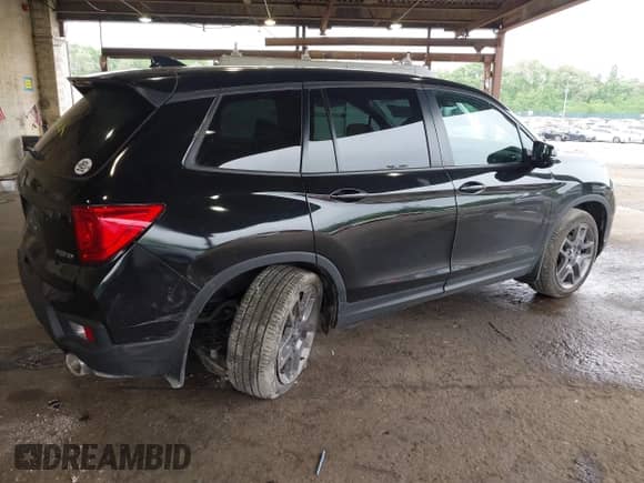 2023 Honda Passport EX-L with VIN 5FNYF8H52PB033173, listed as a IAAI auction lot 42376245 with 24,134 mi miles and . Bid and sale history available at DreamBid. Image 4.