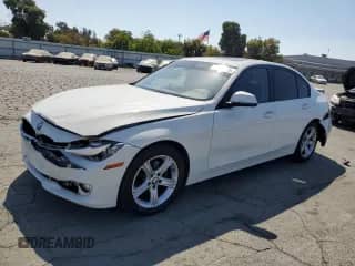2013 BMW 3 Series 320i with VIN WBA3B1C56DK128965, listed as a Copart auction lot 80754735 with 99,102 mi miles and Salvage title. Bid and sale history available at DreamBid. Image 1.