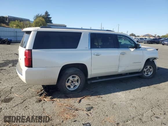 2015 Chevrolet Suburban LTZ с VIN 1GNSKKKC5FR712764, выставлен на аукционе Copart как лот 81138015 с пробегом 148 831 миль миль и Списание • Salvage title. История ставок и продаж доступна на DreamBid. Изображение 3.