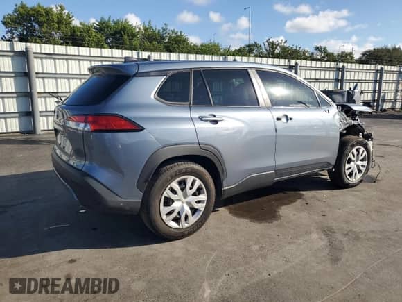 2023 Toyota Corolla Cross L with VIN 7MUAAAAG7PV061474, listed as a Copart auction lot 86704365 with 22,287 mi miles and Salvage title. Bid and sale history available at DreamBid. Image 3.