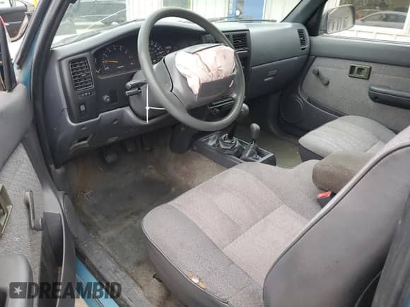 1997 Toyota Tacoma z VIN 4TAWM72NXVZ296658, wystawiony jako Copart lot #78831984 z przebiegiem 228 827 mil mil oraz Szkoda całkowita • Salvage title. Historia ofert i sprzedaży dostępna na DreamBid. Obrazek 8.