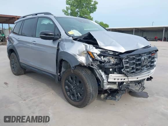 2023 Honda Passport TrailSport z VIN 5FNYF8H66PB044234, wystawiony jako IAAI lot #42462611 z przebiegiem 6 411 mil mil oraz . Historia ofert i sprzedaży dostępna na DreamBid. Obrazek 1.