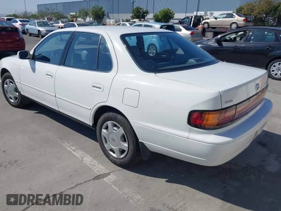 1993 Toyota Camry with VIN 4T1VK12E5PU104089, listed as a IAAI auction lot 42666936 with 123,876 mi miles and . Bid and sale history available at DreamBid. Image 3.