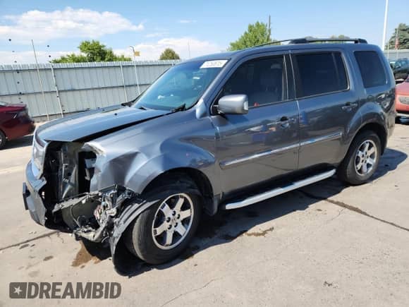 2010 Honda Pilot Touring with VIN 5FNYF4H84AB025991, listed as a Copart auction lot 71250615 with 121,648 mi miles and Salvage title. Bid and sale history available at DreamBid. Image 1.