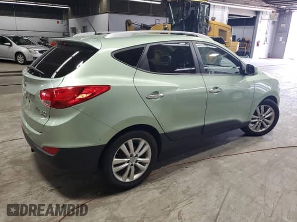 2011 Hyundai Tucson GLS with VIN KM8JU3ACXBU225908, listed as a Copart auction lot 71079005 with 114,646 mi miles and Salvage title. Bid and sale history available at DreamBid. Image 3.