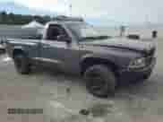 2003 Dodge Dakota с VIN 1D7FL36X03S159557, выставлен на аукционе Copart как лот 85516535 с пробегом 209 972 миль миль и Списание • Salvage title. История ставок и продаж доступна на DreamBid. Изображение 4.