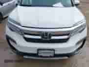 2022 Honda Pilot Touring 8-Passenger with VIN 5FNYF5H99NB001383, listed as a IAAI auction lot 41389422 with 56,055 mi miles and . Bid and sale history available at DreamBid. Image 13.