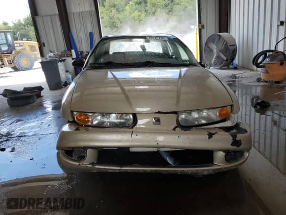 2000 Saturn SL with VIN 1G8ZK5271YZ182706, listed as a Copart auction lot 70810135 with 180,566 mi miles and Salvage title. Bid and sale history available at DreamBid. Image 5.